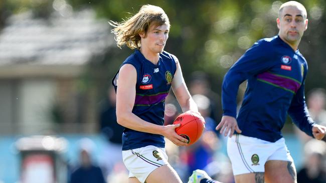 Noah Whittle of the Old Paradians runs with the ball during the 2024 Northern Football Netball League Division 3 Heidelberg Golf Club Seniors Grand Final match between the Fitzroy Stars and the Old Paradians at Lalor Reserve, on September 07, 2024, in Melbourne, Australia. (Photo by Josh Chadwick)