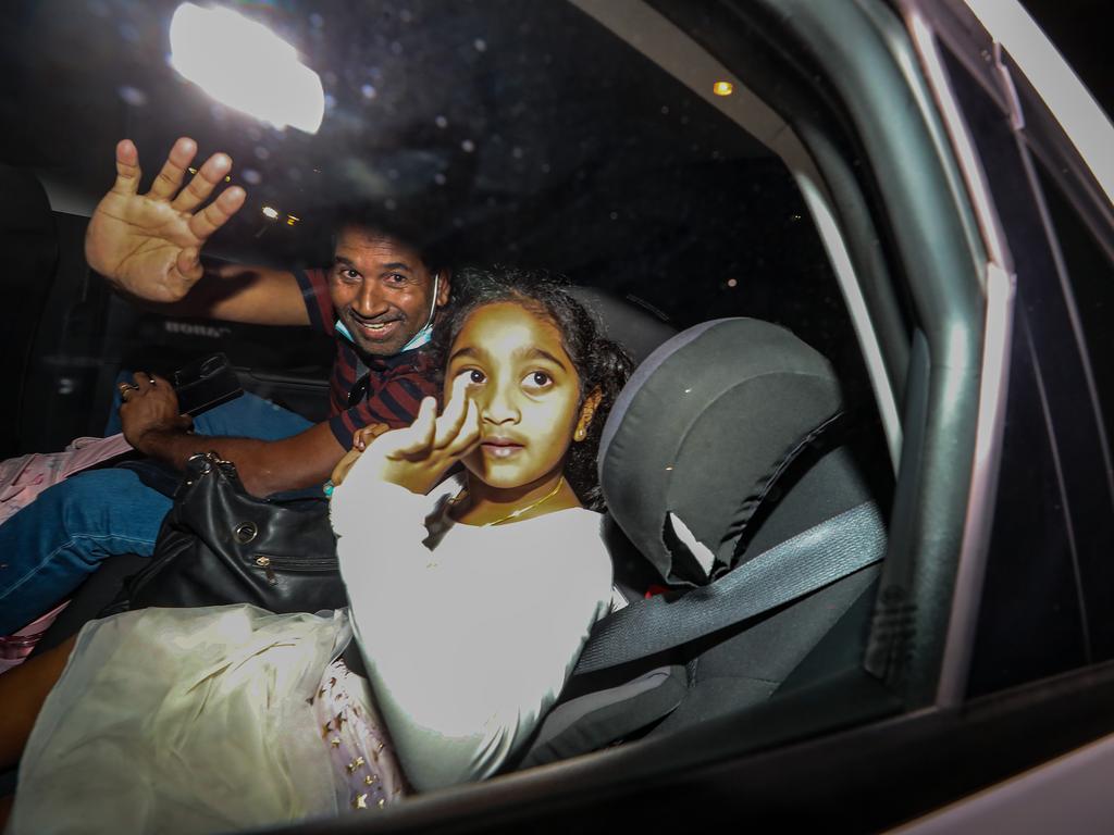 Nades Murugappan and daughter Kopika arrive from Christmas Island to be reunited with his wife and daughter. Picture: Colin Murty/The Australian.