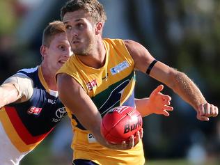 10/04/16 SANFL: Eagles v Adelaide at Woodville Oval. Jarred Allmond hand passes away from Dean Gore. photo Calum Robertson