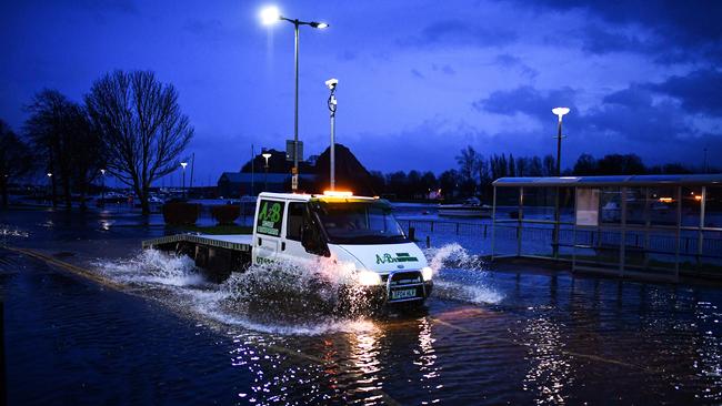 Vehicles make their way through flooding in Dumbarton, Scotland. Picture: Jeff J Mitchell/Getty Images