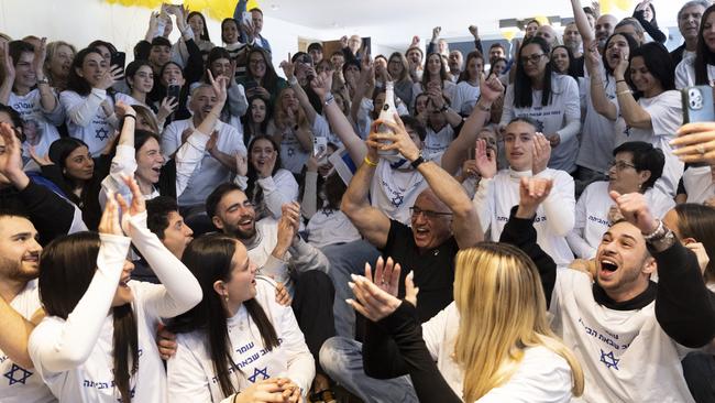 Friends and family of Omer Shem Tov celebrate at a family watch event in Tel Aviv. Picture: Getty Images