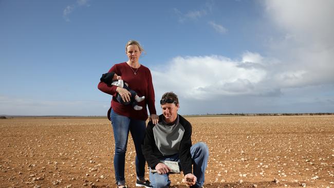 Gabrielle and Jarryn Priess, with baby Bodhi, on their bone dry Arno Bay farm. Picture: ROBERT LANG