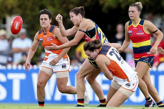 Crows’ Jess Foley shoots out a handpass to team-mate Erin McKinnon against the GWS Giants at Peter Motley Oval. Picture Sarah Reed.