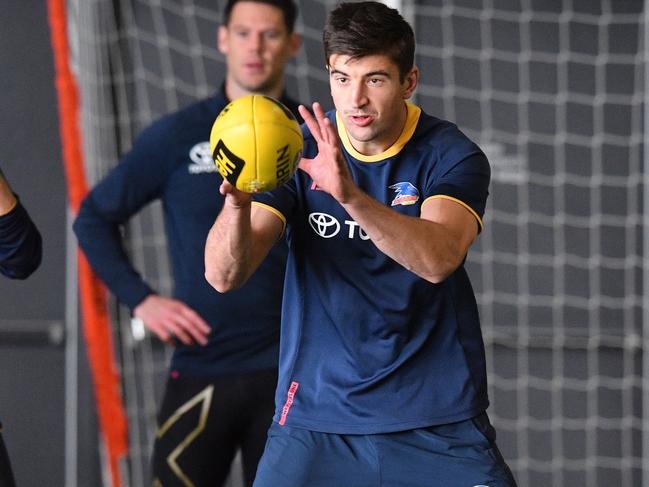 Adelaide Crows debutant Patrick Wilson (right) is seen during a team training session at the indoor training centre at Football Park in West Lakes, Adelaide, Friday June 15, 2018. (AAP Image/David Mariuz) NO ARCHIVING