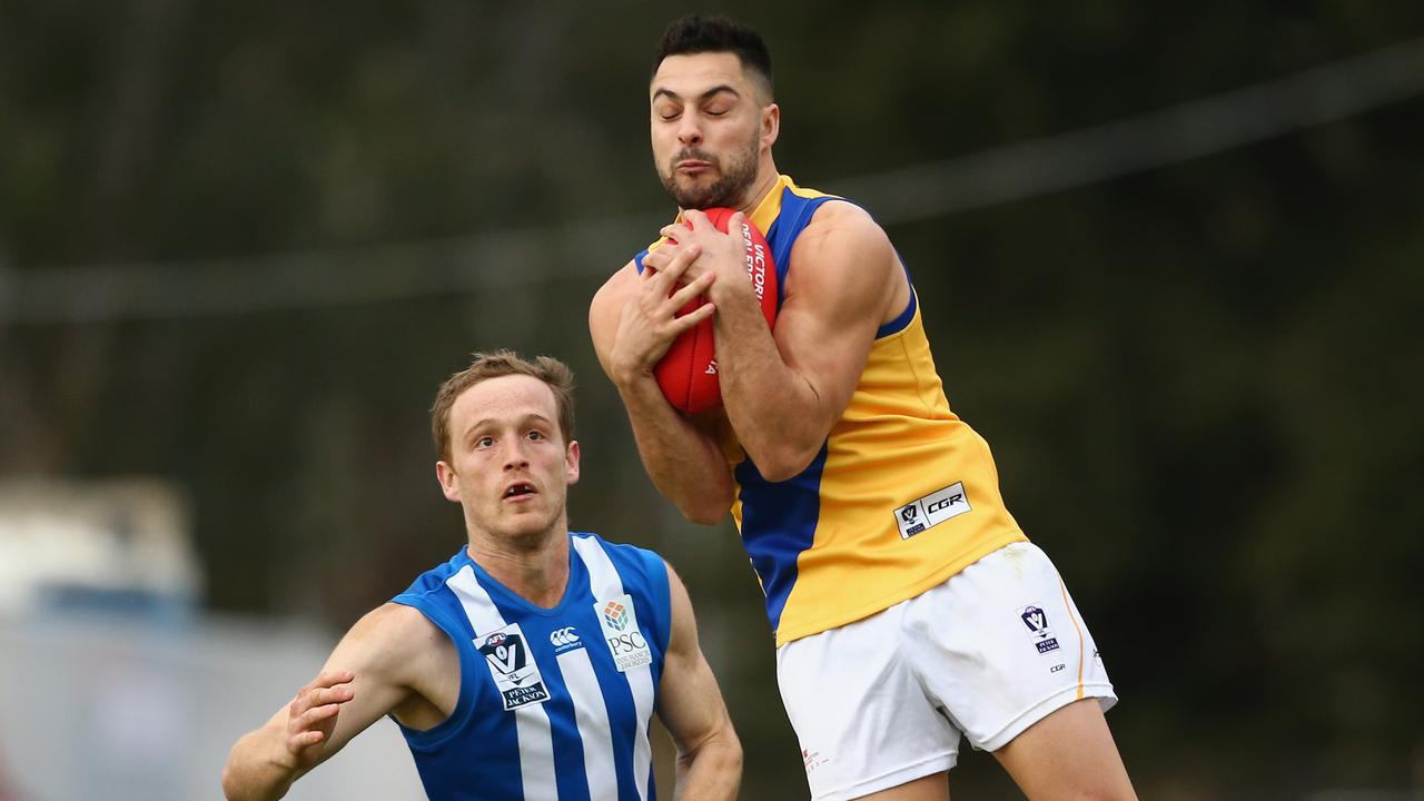 MELBOURNE, AUSTRALIA — AUGUST 04: Michael Gibbons of Williamstown marks the ball during the round 18 VFL match between North Melbourne and Williamstown at Avalon Airport Oval on August 4, 2018 in Melbourne, Australia. (Photo by Mike Owen/AFL Media/Getty Images)