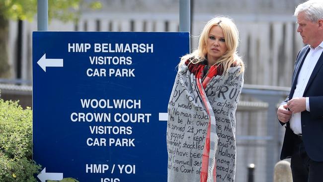 Pamela Anderson leaves Belmarsh Prison in south-east London, accompanied by WikiLeaks editor Kristinn Hrafnsson after visiting Julian Assange. Picture: AP