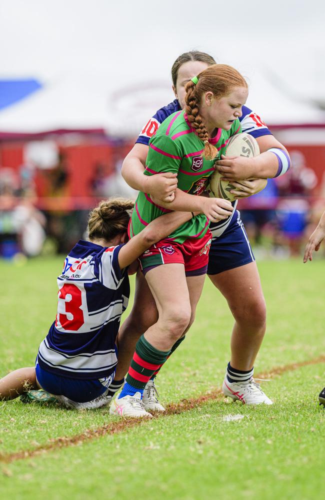 Brothers-Newtown players Ciara Hellyer (left) and Harper Drennert tackle Pittsworth’s Amber Watts during a Walker Weekend Challenge match earlier this year. Hellyer (Newtown) and Drennert (Brothers) will be key players for their respective clubs this season. Picture: Kevin Farmer