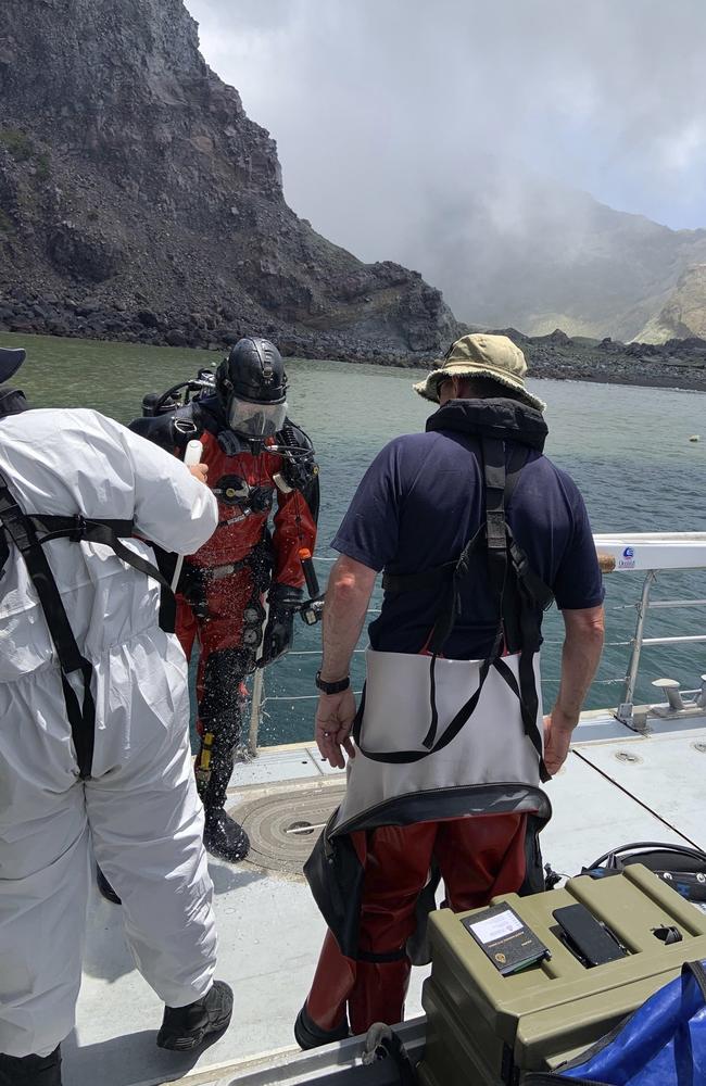 Police divers prepare to search the waters near White Island off the coast of Whakatane, New Zealand. Picture: AP