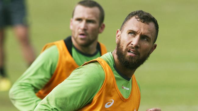 Quade Cooper with Matt Giteau behind during a Wallabies training session at Weigall Sports Ground.