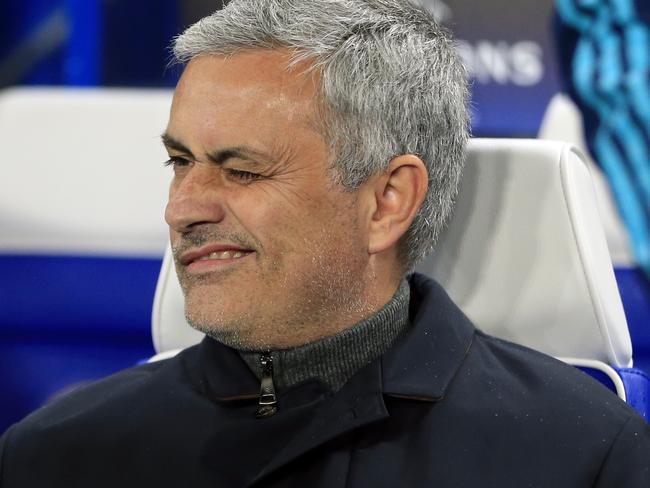 Chelsea manager Jose Mourinho winks while waiting for the start of the Champions League group G soccer match between Chelsea and FC Porto at Stamford Bridge stadium in London, Wednesday, Dec. 9, 2015.(AP Photo/Alastair Grant)