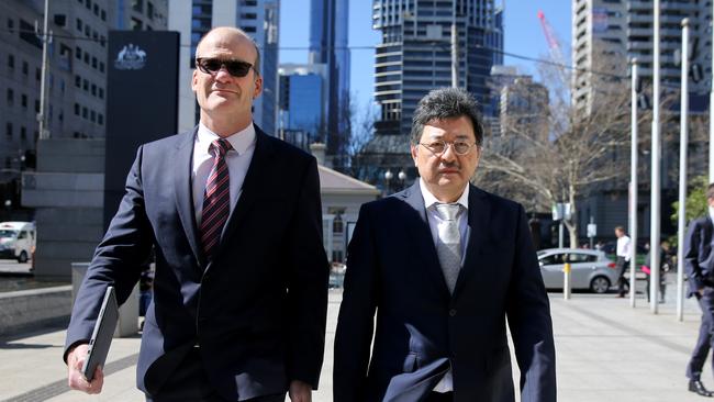 TPG executive chairman David Teoh, right, arrives at the Federal Court in Melbourne. Picture: David Geraghty.