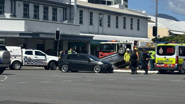 A silver SUV was left on its roof after a three car collision at the corner of Spence and Grafton Street in the Cairns CBD. Photo: Dylan Nicholson