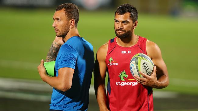 Quade Cooper and Karmichael Hunt talk during a Queensland Reds training session at Ballymore on Thursday night.