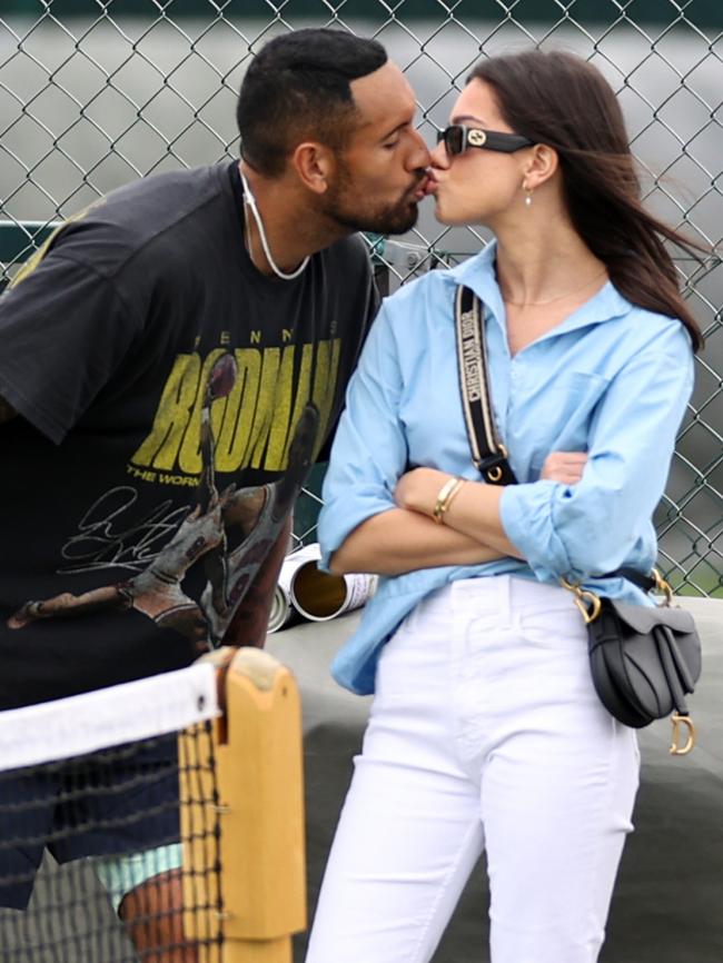 Nick Kyrgios kisses partner Costeen Hatzi during training at Wimbledon. Picture: Getty Images