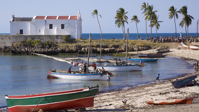 A fishing boat on a beach in Mozambique. Picture: Getty.