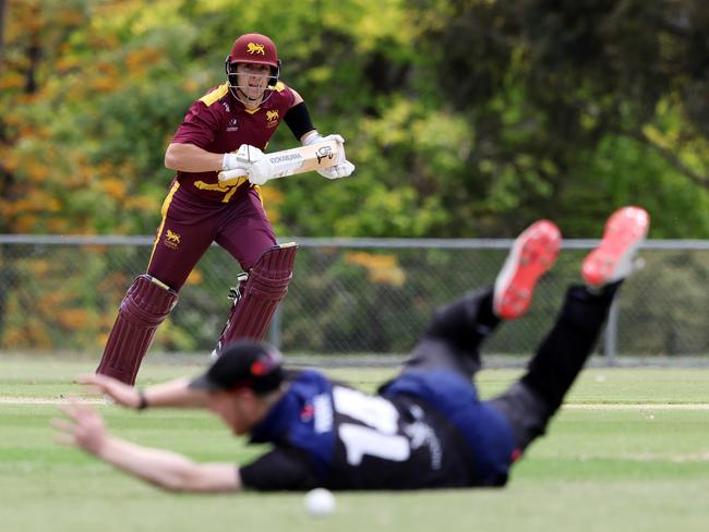 Premier: Noah Korkolis beats the desperate Melbourne University fielder. Picture: George Sal