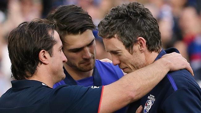 The much-loved Bob Murphy was welcomed on to the podium by coach Luke Beveridge for the 2016 AFL Grand Final celebrations, in scenes which brought tears to even hardened footy fans’ eyes. (Pic: Wayne Ludbey)