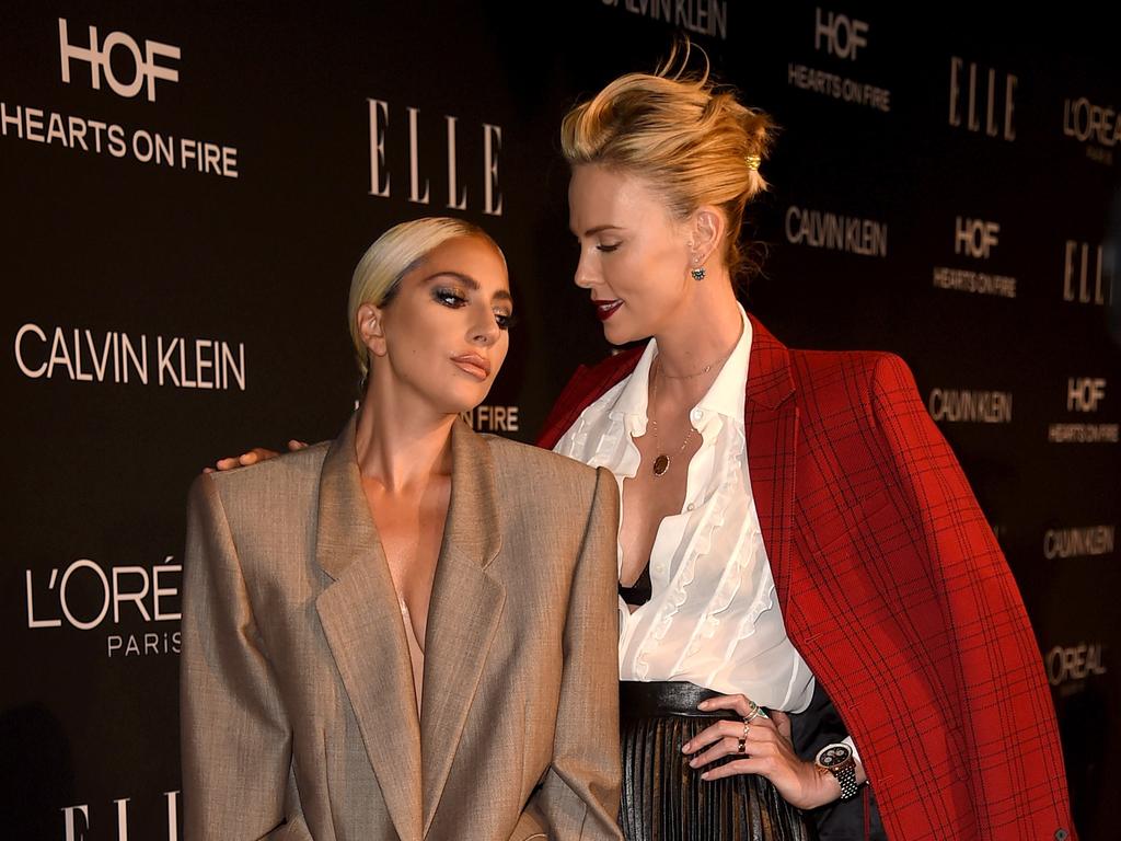 Lady Gaga, with Charlize Theron, rocked a serious Marc Jacobs suit at the Elle Women in Hollywood Celebration in Los Angeles. Picture: Getty Images/AFP