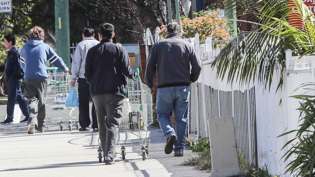 Shoppers push trolleys along Hughes Street, Cabramatta. Picture: Carmela Roche