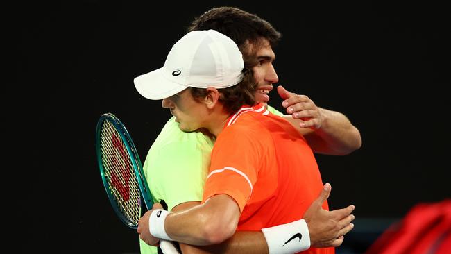 De Minaur embraces Carlos Alcaraz following their charity match. Picture: Graham Denholm/Getty Images