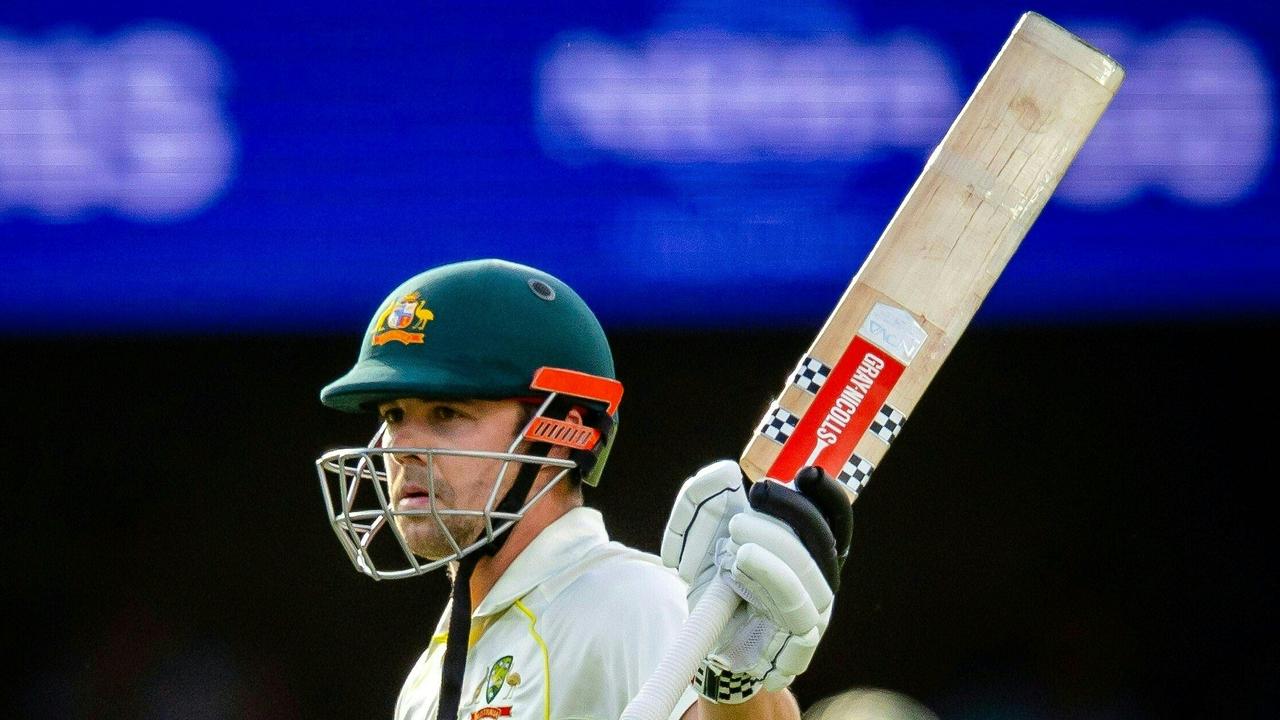 Australia's Travis Head salutes the crowd on his half century during day one of the first cricket Test match between Australia and South Africa at the Gabba in Brisbane on December 17, 2022. (Photo by Patrick HAMILTON / AFP) / - IMAGE RESTRICTED TO EDITORIAL USE - STRICTLY NO COMMERCIAL USE-