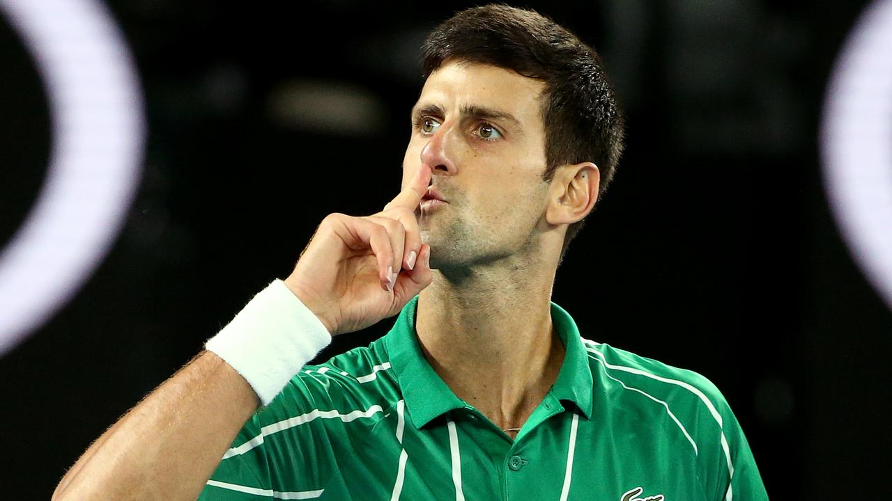 Novak Djokovic of Serbia gestures after winning the men's singles final against Dominic Thiem of Austria on day 14 of the Australian Open tennis tournament at Rod Laver Arena in Melbourne, Sunday, February 2, 2020. (AAP Image/Rob Prezioso) NO ARCHIVING, EDITORIAL USE ONLY