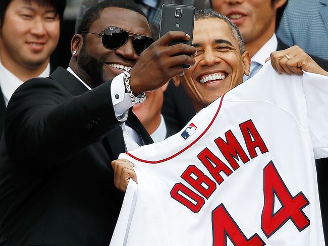 Boston Red Sox designated hitter David Ortiz (L) poses for a “selfie” with U.S. President Barack Obama during a ceremony on the South Lawn of the White House to honor the 2013 World Series Champion Boston Red Sox April 1, 2014 in Washington, DC. Picture: Win McNamee/Getty Images