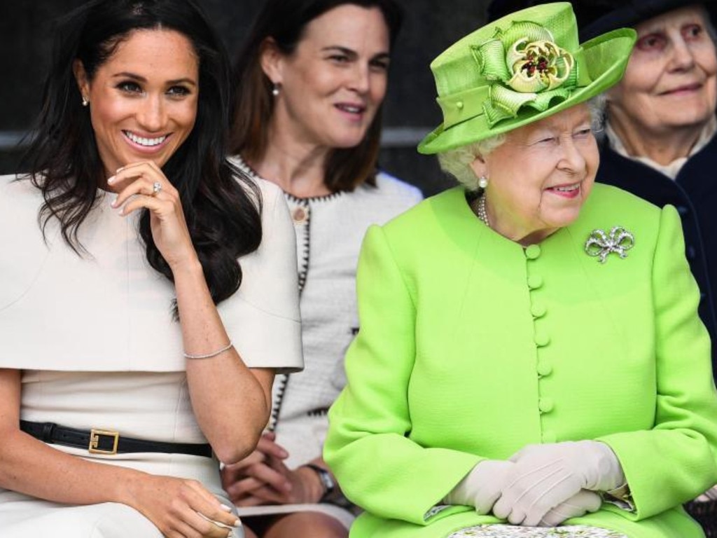 Meghan Markle and the Queen share a joke at their first public engagement together in Cheshire, north west England, last year.