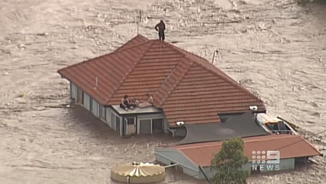 Video still of inundated land and damaged cars and property after flash flood hit city of Toowoomba. Picture: 9 News