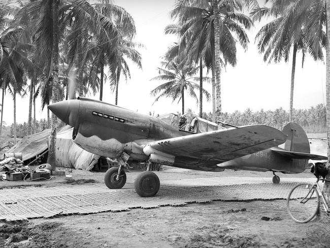 Flying Officer D.E. Pank of No. 75 Fighter Squadron, RAAF, taxiing his P40 Kittyhawk along the dispersal runway after a flight. Picture: Australian War Memorial