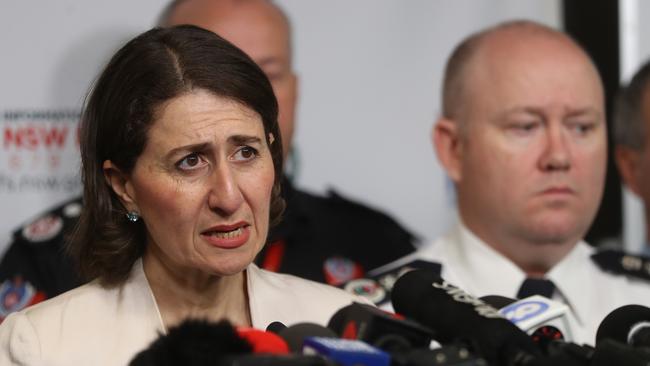 NSW Premier Gladys Berejiklian and NSW Rural Fire Service Commissioner Shane Fitzsimmons speak to the media this morning. Picture: John Grainger