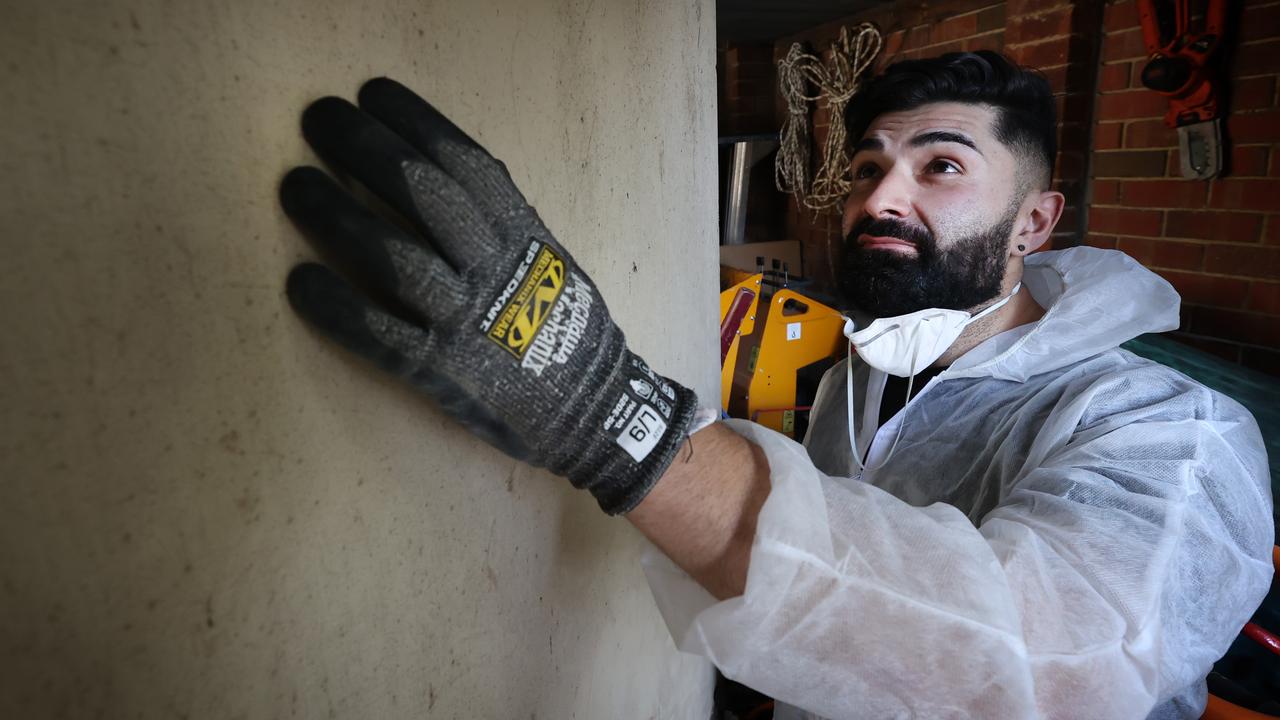 Steven Constantinou looks for signs of mould in a Victorian home. Picture: David Caird