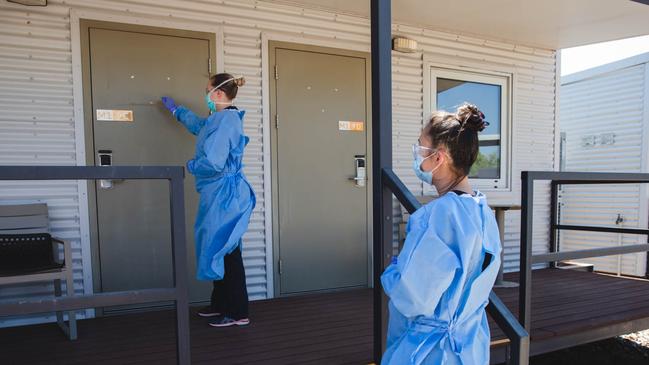 An NT Health worker checking in on a Howard Springs Quarantine Facility resident. Picture: Suppled/ NT Health