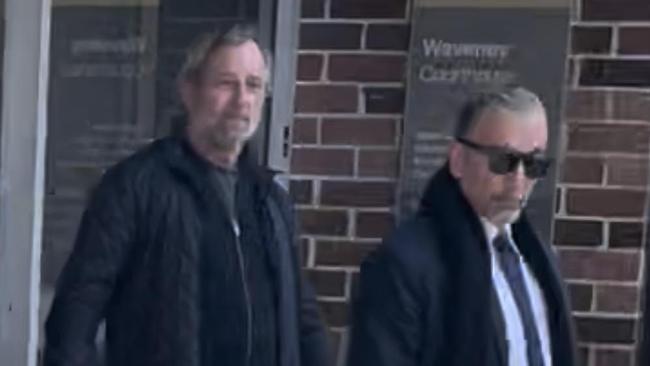 Mark Rene Lewinsohn (left) leaving court with his lawyer.