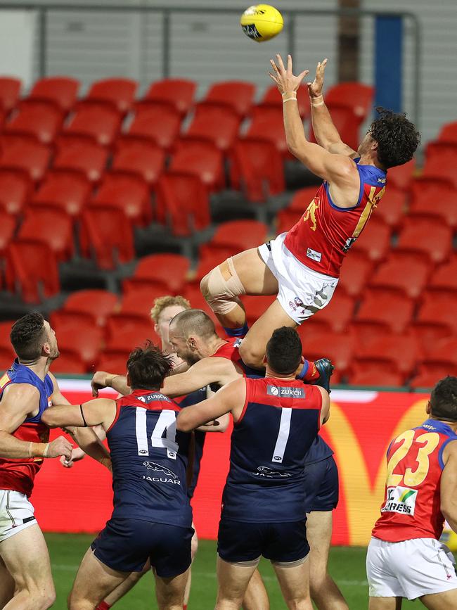 Cam Rayner flies high over Max Gawn. Picture: Michael Klein