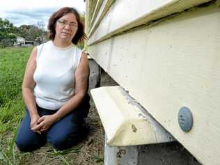 INSURANCE CLAIM: Jessie Harlow inspects the damage to her North Ipswich home she believes was caused by high winds in a storm in October last year. Picture: Rob Williams