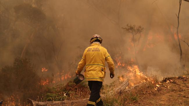 Light rain makes backburning operations much more difficult for firefighters. Picture: David Swift.