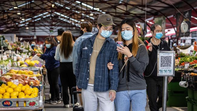 Queen Victoria Market shoppers in Melbourne’s CBD mask up as Victoria breaks the 2000 mark for daily virus cases. Picture: Sarah Matray