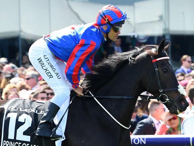 Jockey Michael Walker riding jockey of Prince of Arran enters the field on Rostropovich ahead of race 7, the Lexus Melbourne Cup at Flemington Racecourse in Melbourne, Tuesday, November 5, 2019. (AAP Image/James Ross) NO ARCHIVING, EDITORIAL USE ONLY