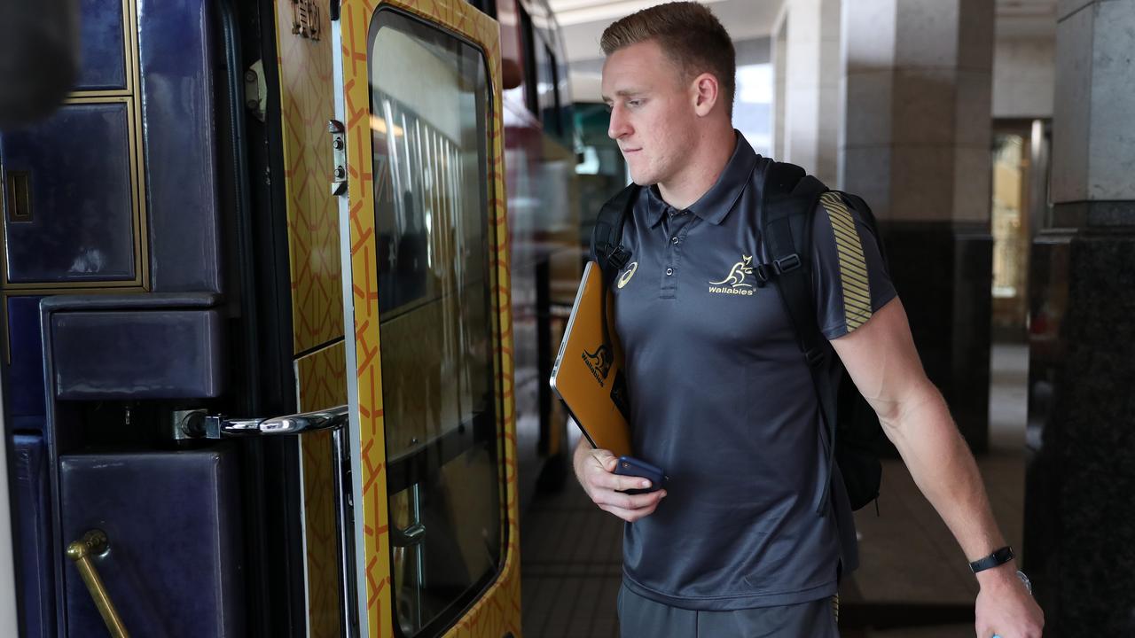 Reece Hodge of Australia boards the team bus to head to the airport.