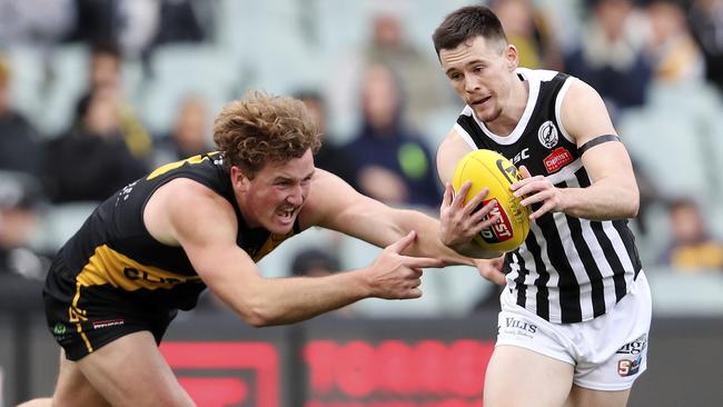 Glenelg’s Will Gould chases Port Adelaide’s Sam Davidson in the SANFL semi-final. Picture SARAH REED