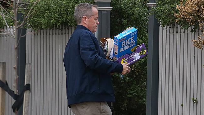 Former Labor leader Bill Shorten returns to his Melbourne home with the shopping yesterday. Picture: Ian Currie