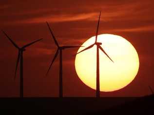 FILE - In this Aug. 23, 2013 file photo, wind turbines are silhouetted by the setting sun as they produce electricity . (AP Photo/Charlie Riedel, File). Picture: Charlie Riedel