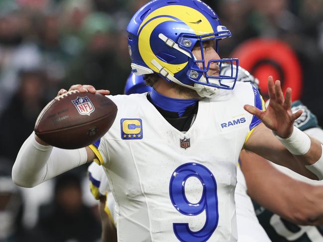 PHILADELPHIA, PENNSYLVANIA - JANUARY 19: Matthew Stafford #9 of the Los Angeles Rams looks to pass during the NFC Divisional playoff game against the Philadelphia Eagles at Lincoln Financial Field on January 19, 2025 in Philadelphia, Pennsylvania. The Eagles defeated the Rams 28-22. (Kara Durrette/Getty Images)