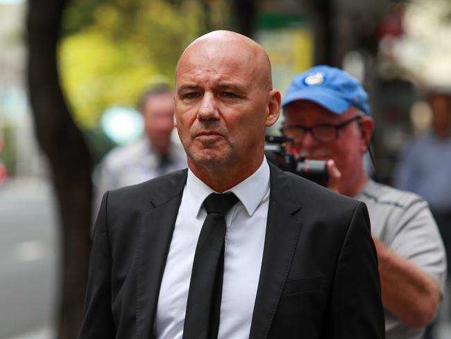 Former detective Gary Jubelin leaves Downing Centre Local Court on Monday.