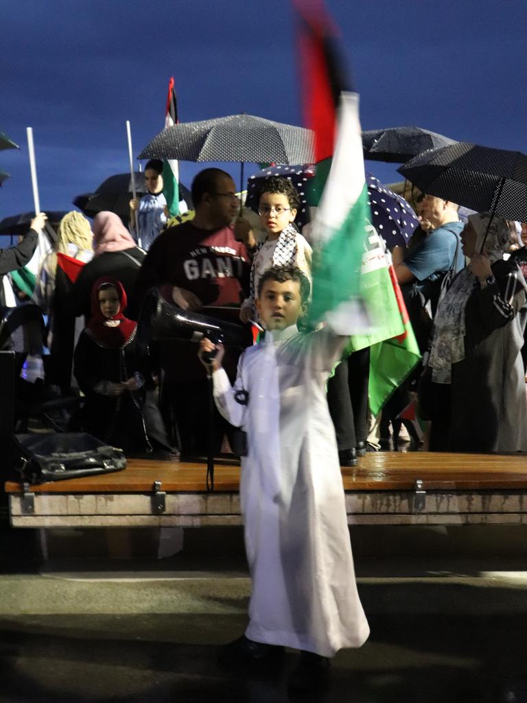 Young children were among an estimated crowd of 200 protesters who gathered at Surfers Paradise Esplanade to call for an immediate ceasefire of bombing in the Gaza Strip. Picture: Amaani Siddeek