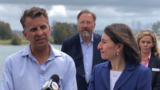 Lurking in wait … future Labor MP Michael Holland centre with Liberal Bega MP Andrew Constance and then NSW premier Gladys Berejiklian