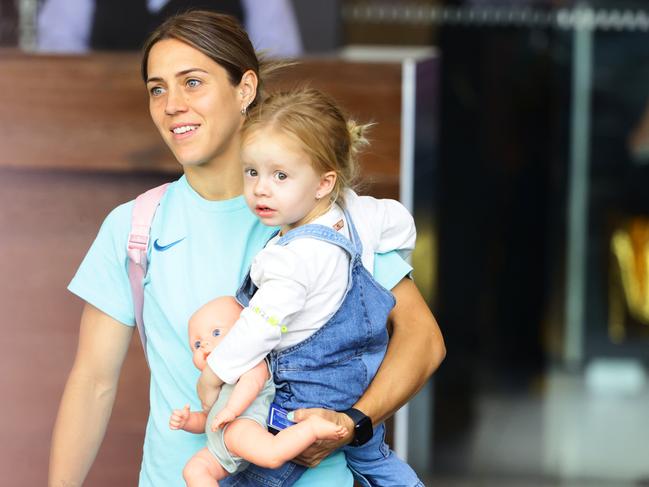 Katrina Gorry with daughter Harper departing the team hotel in Brisbane. Picture: Lachie Millard