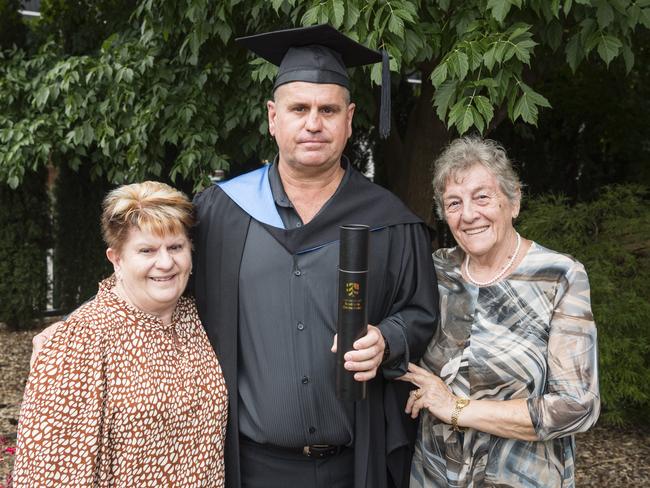 Bachelor of Paramedicine graduate Brett Wilkie with mum Valerie Wilkie (left) and mother-in-law Carmen Simonato at a UniSQ graduation ceremony at Empire Theatres, Tuesday, February 13, 2024. Picture: Kevin Farmer