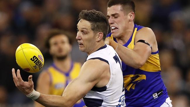 Harry Taylor juggles the ball in front of Eagle Jake Waterman.